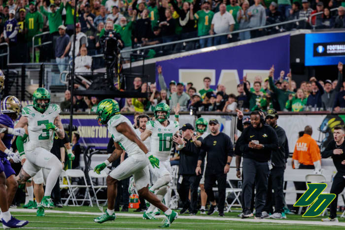 Oregon Ducks quarterback Bo Nix runs against the Washington Huskies in the Pac-12 Championship.